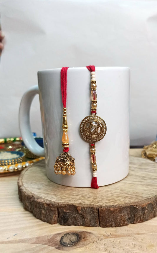 Antique Gold Rakhi with Jhumka Charm - Orange Detailing