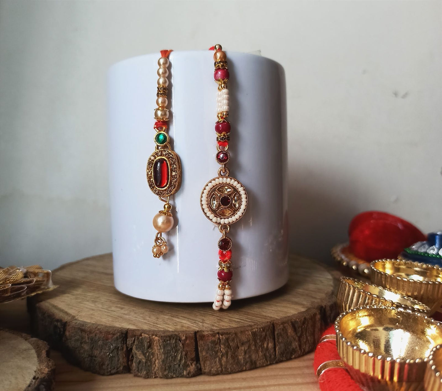 Antique Gold Rakhi with Jhumka Charm - Red Detailing