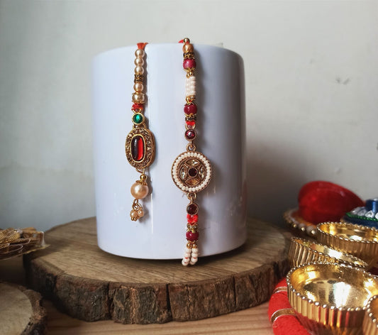 Antique Gold Rakhi with Jhumka Charm - Red Detailing